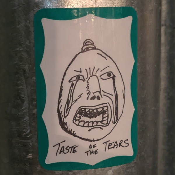 A crying egg with the words Taste of the Tears